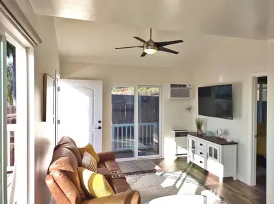 a living room with a couch and a ceiling fan at Stylish Relaxation-Panoramic Views-Private OASIS in El Cajon