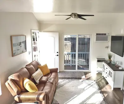 a living room with a couch and a ceiling fan at Stylish Relaxation-Panoramic Views-Private OASIS in El Cajon