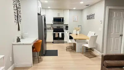 a kitchen and dining room with a table and a refrigerator at 321 W Park 2Bed 1Bath Unit A by SD Stay in El Cajon