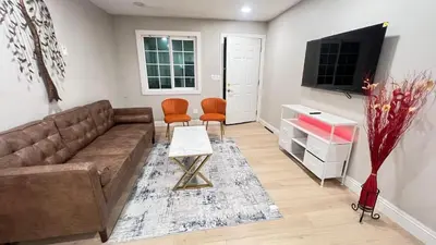 a living room with a couch and a tv at 321 W Park 2Bed 1Bath Unit A by SD Stay in El Cajon