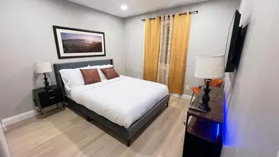 a bedroom with a bed and two lamps and a television at 321 W Park 2Bed 1Bath Unit A by SD Stay in El Cajon