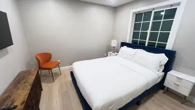 a bedroom with a bed and a chair and a window at 321 W Park 2Bed 1Bath Unit A by SD Stay in El Cajon