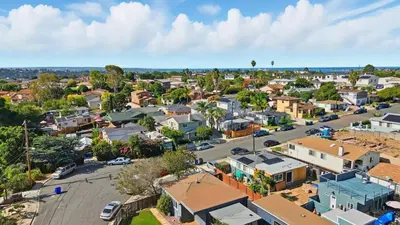 an aerial view of a small town with houses at Hot Tub • BBQ Island • Outdoor Living • Near San Diego Beaches Glidden Glow by AvantStay in San Diego