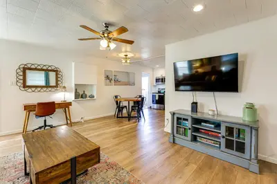 a living room with a flat screen tv on a wall at Private Hilltop Getaway with Patio Dogs Welcome! in Vista