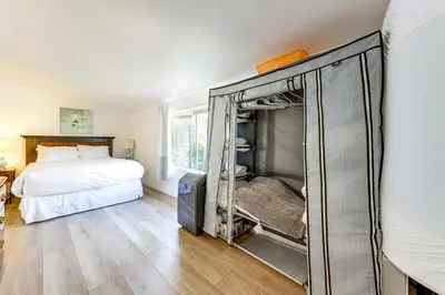 a bedroom with a bed and a mirror on the wall at Private Hilltop Getaway with Patio Dogs Welcome! in Vista