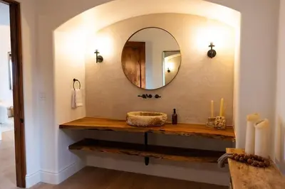 a bathroom with a sink and a mirror at Sunset Point Estate in Poway