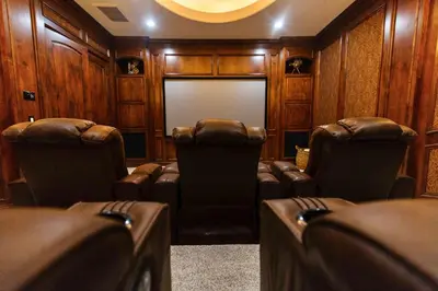 a movie room with two chairs and a screen at Sunset Point Estate in Poway