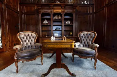 two chairs and a table in a room with a desk at Sunset Point Estate in Poway
