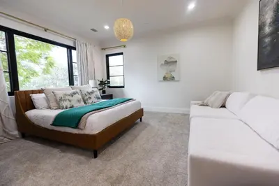 a living room with a bed and a couch at Sunset Point Estate in Poway