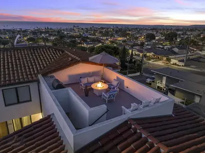 a view from the roof of a house with a table and chairs at Walk to Pier and Downtown San Clemente Rooftop Deck in San Clemente