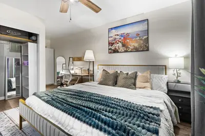 a bedroom with a bed and a painting on the wall at Entire Private Home with 1 Bedroom, 1 Bathroom, King Bed, Hot Tub, Parking, View, Available Now in San Diego