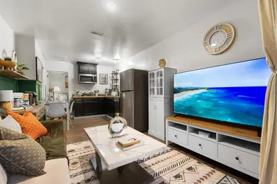 a living room with a large flat screen tv at Entire Private Home with 1 Bedroom, 1 Bathroom, King Bed, Hot Tub, Parking, View, Available Now in San Diego