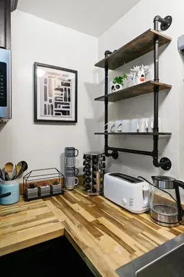 a kitchen counter with a toaster on a wooden floor at Entire Private Home with 1 Bedroom, 1 Bathroom, King Bed, Hot Tub, Parking, View, Available Now in San Diego