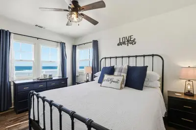 a bedroom with a bed and a ceiling fan at NEW Oceanfront Luxury Christian RARE Single Family Home in San Diego