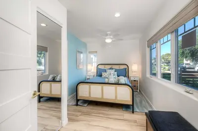 a bedroom with two beds and a window at Monarch Cove - Unit A For 7ppl in Oceanside