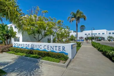 a sign for the okefenokee civic center at Monarch Cove - Unit A For 7ppl in Oceanside