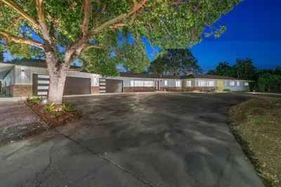 a house with a tree in the middle of a driveway at Mt. Helix Resort+ Pool/Spa, Pickleball, Amenities! in La Mesa