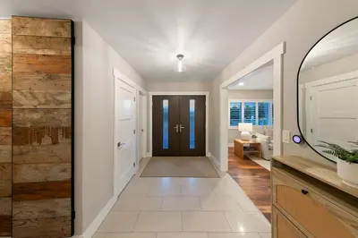 a hallway with a sliding door in a house at Mt. Helix Resort+ Pool/Spa, Pickleball, Amenities! in La Mesa