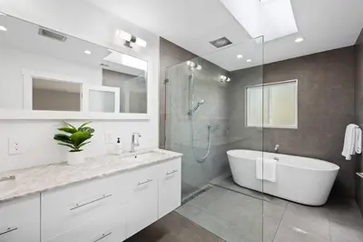 a bathroom with a tub and a glass shower at Mt. Helix Resort+ Pool/Spa, Pickleball, Amenities! in La Mesa