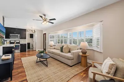 a living room with a couch and a table at Mt. Helix Resort+ Pool/Spa, Pickleball, Amenities! in La Mesa