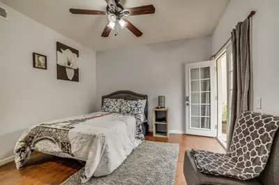 a bedroom with a bed and a ceiling fan at Sip, Hike and Explore Quiet SoCal Studio with Patio! in Winchester