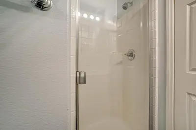 a bathroom with a shower with a glass door at Sip, Hike and Explore Quiet SoCal Studio with Patio! in Winchester