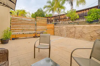 a patio with two chairs and a fence at Sip, Hike and Explore Quiet SoCal Studio with Patio! in Winchester