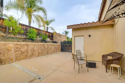 a patio with chairs and a table and a fence at Sip, Hike and Explore Quiet SoCal Studio with Patio! in Winchester