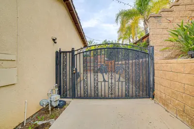 an entrance to a house with a blue gate at Sip, Hike and Explore Quiet SoCal Studio with Patio! in Winchester