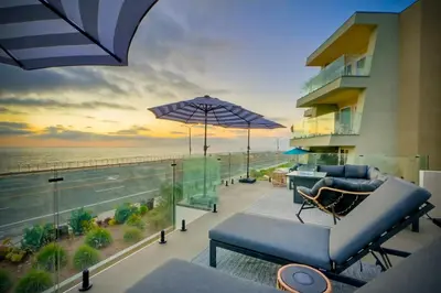 a living room with a view of the ocean at Modern Ocean-View Retreat w/ Firepit & Steps to Carlsbad Beach in Carlsbad