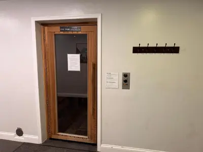 a glass door with a sign on a wall at Stunning Oceanview Penthouse | 2BR, Sleeps 6 | North Coast Village Resort in Oceanside