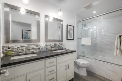 a bathroom with a toilet and a sink and a shower at Luxury 3-Bed Beach Cottage with Hot Tub, Fire Pit, BBQ - Walk To Beach in Cardiff-by-the-Sea