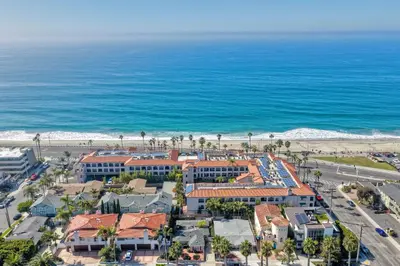 an aerial view of a resort and the beach at Coastal Cottage Steps from the Sand | Walk to Carlsbad Village, Dog-Friendly in Carlsbad