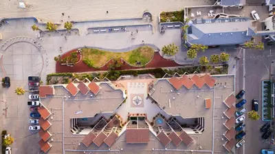 an overhead view of a building with a park at Pier View Sunset - Ocean Front, Patios, Location, Views in San Diego