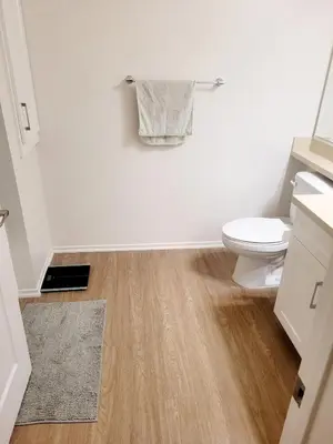 a bathroom with a toilet and a rug at Irvine Spectrum 1 bed 1 bath in Irvine