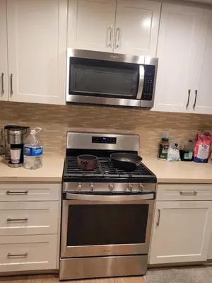 a kitchen with a stove and a microwave at Irvine Spectrum 1 bed 1 bath in Irvine