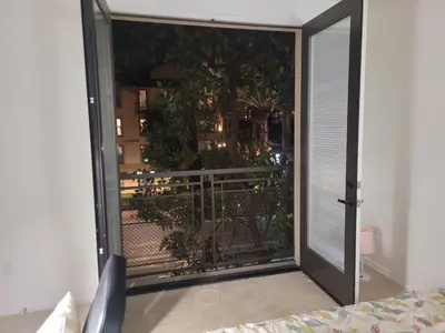 a sliding glass door leading to a balcony with a view at Irvine Spectrum 1 bed 1 bath in Irvine