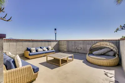 two couches and a table on a patio at By Seaport Village and Navy Base! Chic Condo with Pool in National City