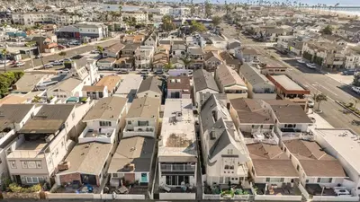 an aerial view of a town with houses at Seabright Sky by AvantStay Top-Floor West Newport Retreat • Balcony Near Beach Cafes in Newport Beach