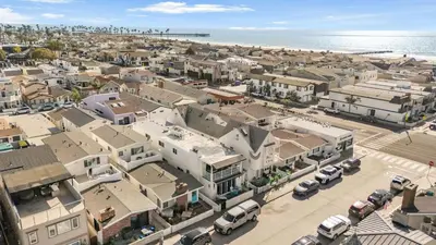an aerial view of a city with buildings and the ocean at Seabright Sky by AvantStay Top-Floor West Newport Retreat • Balcony Near Beach Cafes in Newport Beach