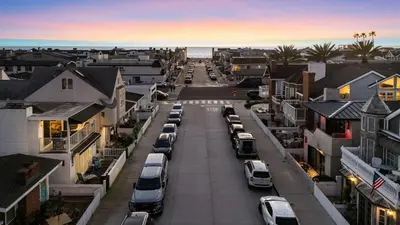 an aerial view of a city street with parked cars at Seabright Sky by AvantStay Top-Floor West Newport Retreat • Balcony Near Beach Cafes in Newport Beach