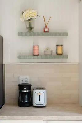 a coffee maker sitting on a counter in a kitchen at The Palm House by Coastline Vacation Rentals in San Diego