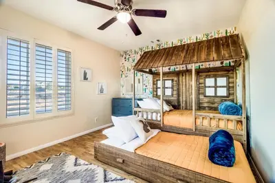a bedroom with a bed and a ceiling fan at Hilltop Wine Estate- Pickleball - Pool - 360 views in Temecula
