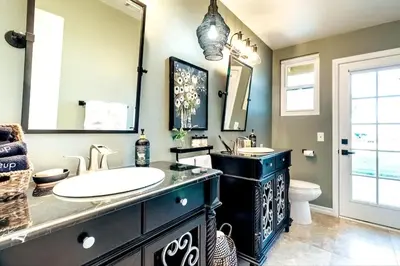 a bathroom with a sink and a large mirror at Hilltop Wine Estate- Pickleball - Pool - 360 views in Temecula
