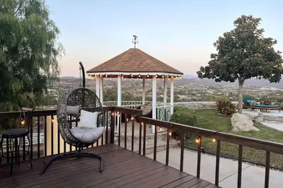 a deck with a gazebo and a chair at Hilltop Wine Estate- Pickleball - Pool - 360 views in Temecula