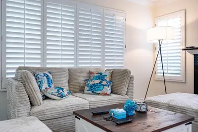 a living room with a couch and a table at Luxe 2-Story Oasis with Private Pool & Backyard in Laguna Niguel