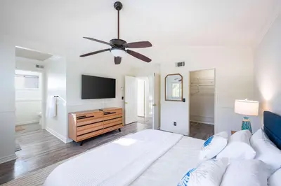 a living room with a couch and a flat screen tv at Luxe 2-Story Oasis with Private Pool & Backyard in Laguna Niguel