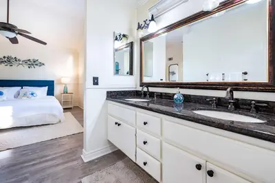 a bathroom with two sinks and a large mirror at Luxe 2-Story Oasis with Private Pool & Backyard in Laguna Niguel