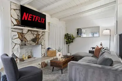 a living room with a couch and a fireplace at 4BR Family Retreat with Hot Tub Games & Fire Pit in Chula Vista
