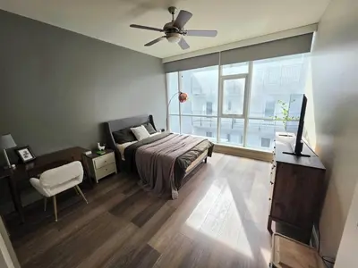 a bedroom with a bed and a ceiling fan at Downtown Beautiful 3-bedroom Apartment Steps to Convention Center, Petco Park! in San Diego